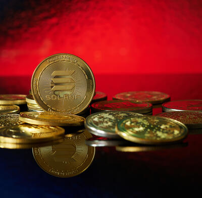 A physical depiction of Solana coins