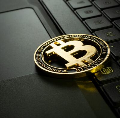 Bitcoin on a computer keyboard